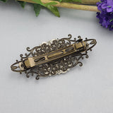 Antiqued Brass Filigree Barrette with Silver Rabbit Design.