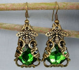 Green Crystal Stones Wrapped in Intricate Filigree with a Delicate Bee Design.